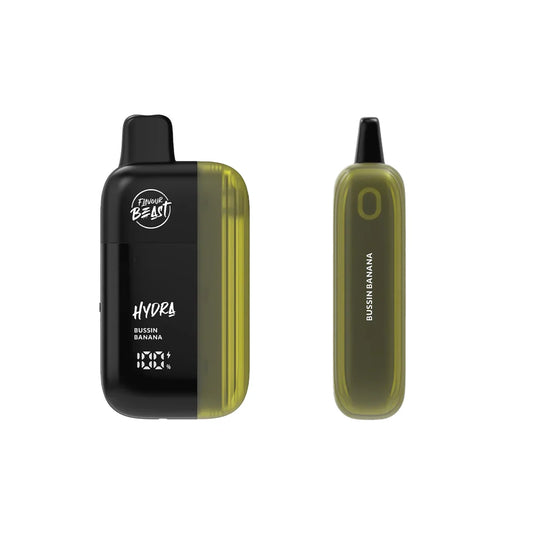 Two Flavour Beast Hydra disposable vapes in Bussin Banana flavor are displayed against a white background, showing the black and olive green device from both the front and side angles with the text Flavour Beast, Hydra, and Bussin Banana visible on the casing.