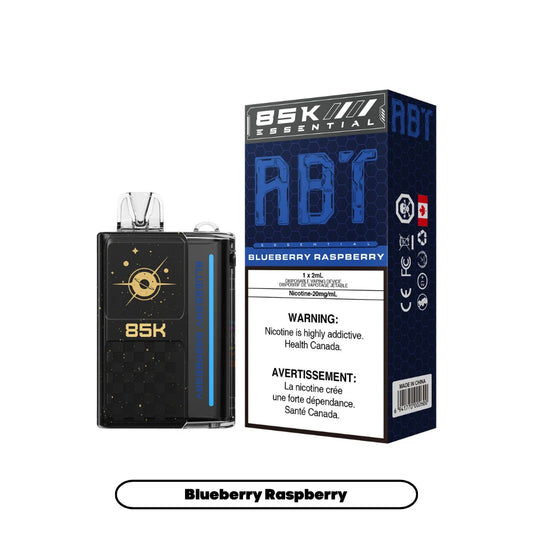 An ABT 85K disposable vape device in black with gold celestial graphics sits next to its matching blue and black hexagonal-patterned packaging labeled Blueberry Raspberry with a 20mg/mL nicotine warning.