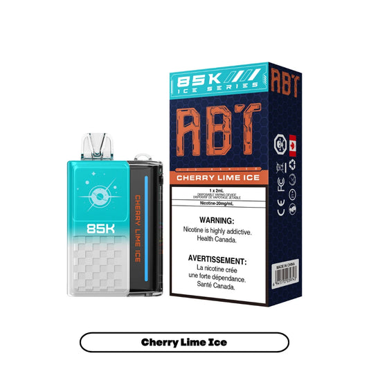 An ABT 85K disposable vape device in teal and white sits next to its matching product box, which features the Cherry Lime Ice flavor name, a Health Canada nicotine warning, and a 20mg/mL nicotine strength label against a dark blue honeycomb background.