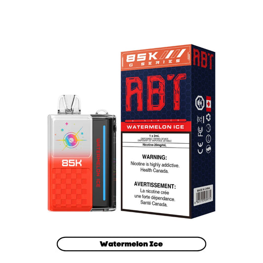 An ABT 85K disposable vape device in red and white with a planet graphic sits next to its matching product box labeled Watermelon Ice and featuring mandatory nicotine health warnings against a plain white background.