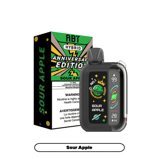 An ABT Hybrid Anniversary Edition disposable vape in Sour Apple flavor displayed next to its green and black packaging box, featuring a digital screen showing battery and wattage levels on a sleek, dark device.