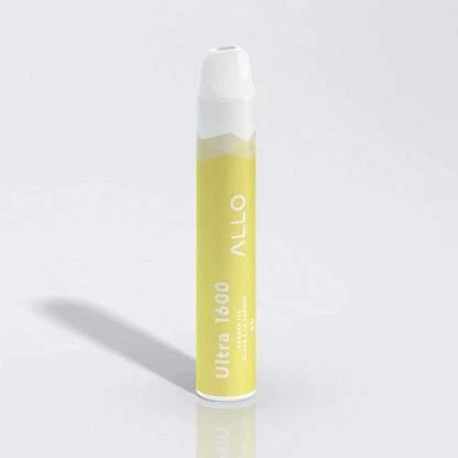 Allo Ultra 1600 Banana Ice disposable vape featuring a yellow cylindrical body with a white mouthpiece and text reading Ultra 1600, Banana Ice, and Allo.