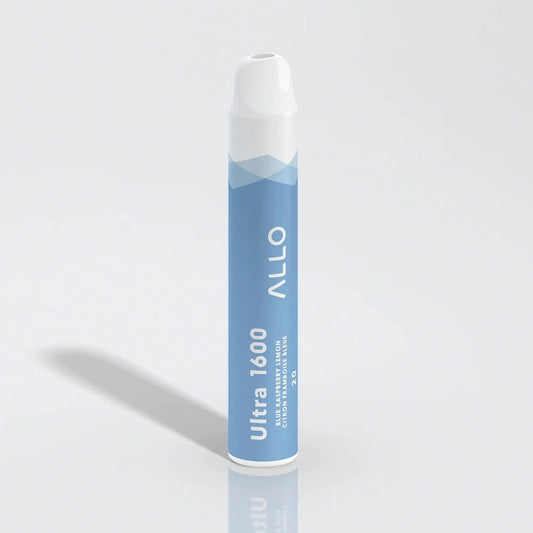 An Allo Ultra 1600 Blue Raspberry Lemon disposable vape stands upright on a reflective white surface, featuring a light blue cylindrical body with white text and a white mouthpiece.