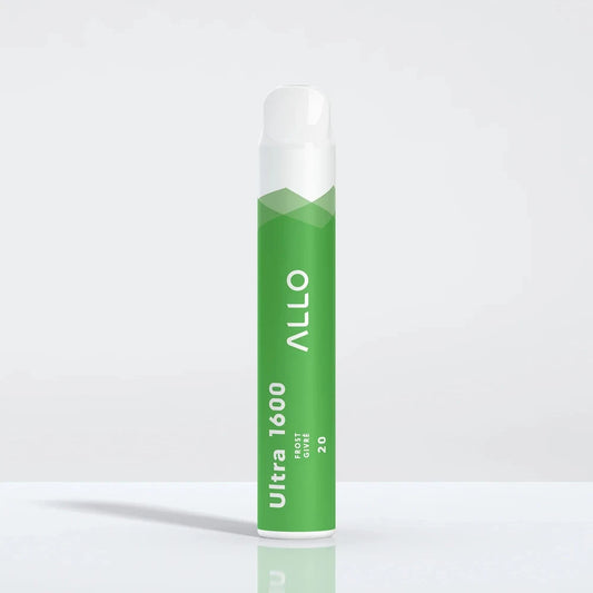An Allo Ultra 1600 Frost disposable vape with a green cylindrical body and white mouthpiece, featuring the text Allo Ultra 1600 Frost Givré 20, standing on a reflective white surface.