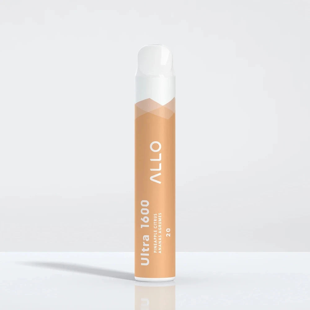 An Allo Ultra 1600 Pineapple Citrus disposable vape featuring a light orange body with white text and a white mouthpiece, standing upright on a reflective white surface.