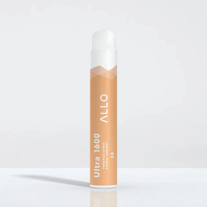 An Allo Ultra 1600 Pineapple Citrus disposable vape featuring a light orange body with white text and a white mouthpiece, standing upright on a reflective white surface.