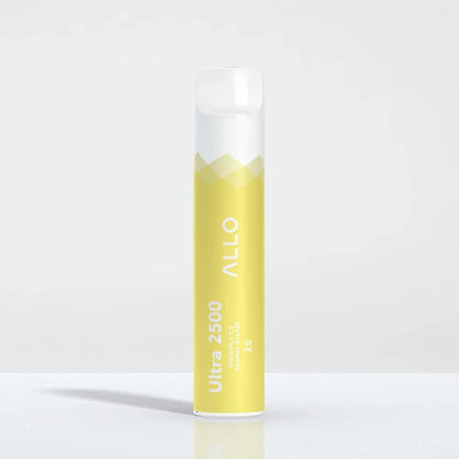 An Allo Ultra 2500 Pineapple Ice disposable vape featuring a yellow and white cylindrical body with the Allo logo and Ultra 2500 text, standing on a reflective white surface.