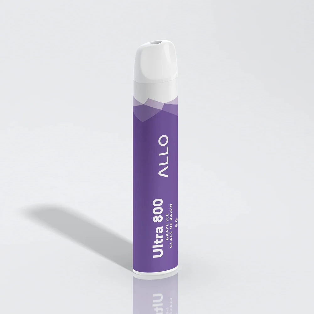 An ALLO Ultra 800 Grape Ice disposable vape featuring a purple cylindrical body with white text and a white mouthpiece, standing upright on a reflective white surface.