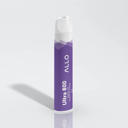 An ALLO Ultra 800 Grape Ice disposable vape featuring a purple cylindrical body with white text and a white mouthpiece, standing upright on a reflective white surface.