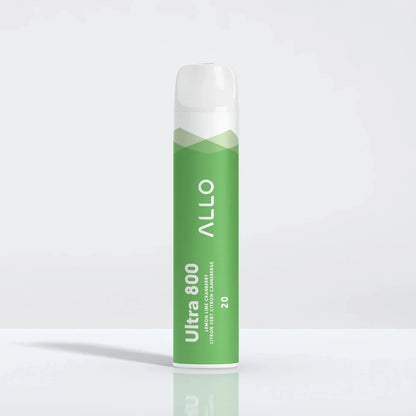 A green Allo Ultra 800 Lemon Lime Cranberry disposable vape with a white mouthpiece stands upright on a reflective white surface.