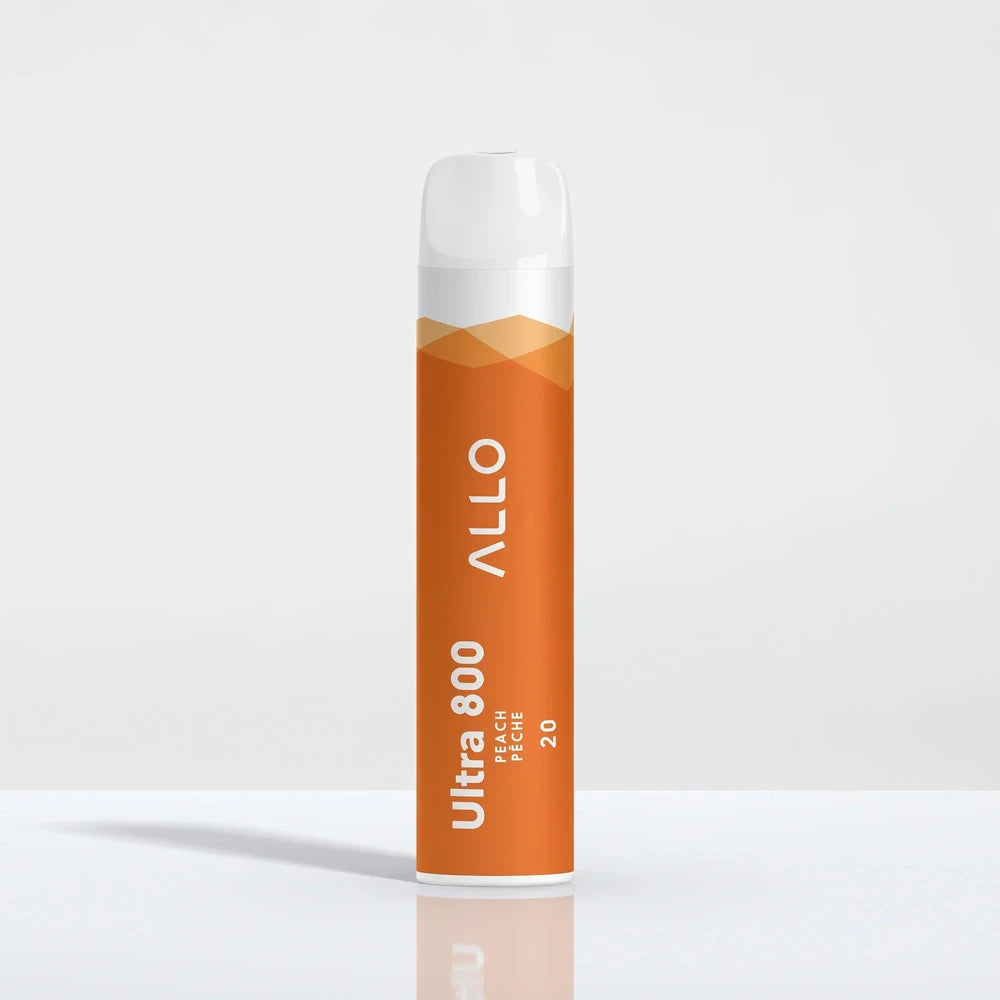 An Allo Ultra 800 Peach disposable vape with an orange body and white mouthpiece, featuring the text ALLO Ultra 800 Peach Pêche 20, shown on a reflective white surface.