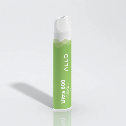 An ALLO Ultra 800 Spearmint disposable vape featuring a green and white cylindrical body with a white mouthpiece, labeled with ALLO and Ultra 800 Spearmint Menthe Verte text, standing upright on a reflective white surface.