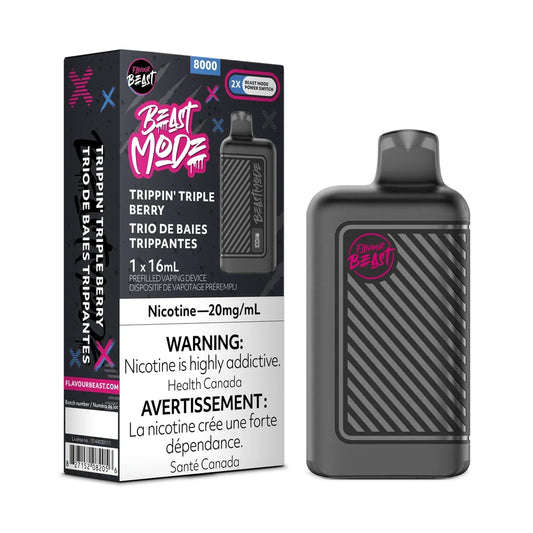 A Flavour Beast Mode 8K disposable vape device in black with a striped texture sits next to its matching product box, which features the Trippin' Triple Berry flavor name, a 20mg/mL nicotine warning, and a 16mL capacity label against a dark, graffiti-style background.