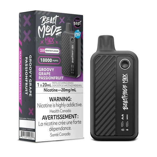 A Beast Mode Max 18K disposable vape device in matte black stands next to its matching retail box, which features purple accents and displays the Groovy Grape Passionfruit flavour name along with mandatory nicotine warning text in English and French.