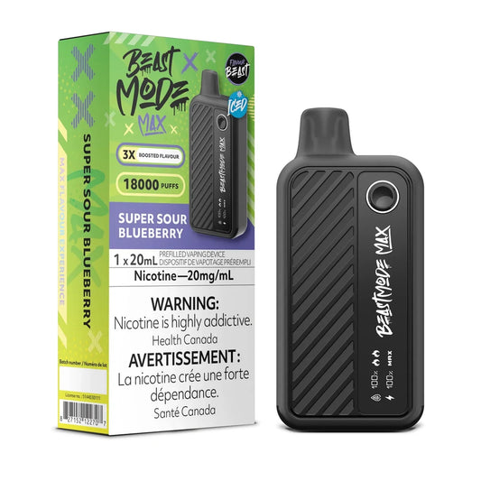 A Beast Mode Max 18K Super Sour Blueberry Iced disposable vape device stands next to its green and purple packaging, which displays the product name, 18000 puff count, 20mg/mL nicotine content, and bilingual health warnings.