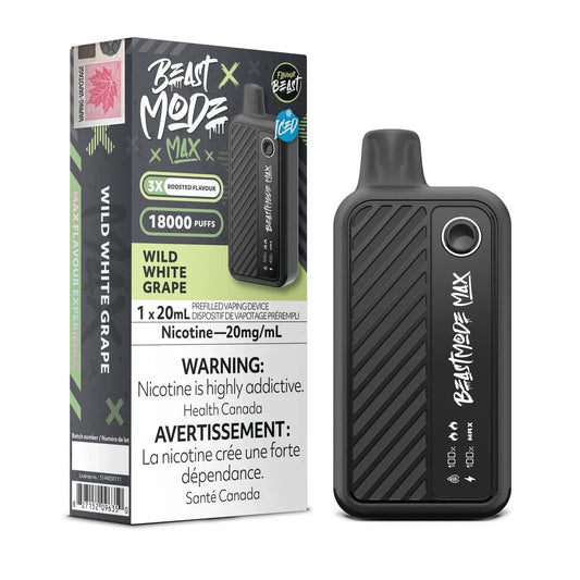 A Beast Mode Max 18K Wild White Grape Iced disposable vape device stands next to its black and green retail box, which displays the product name, 18000 puffs, 20mg/mL nicotine content, and bilingual health warnings.
