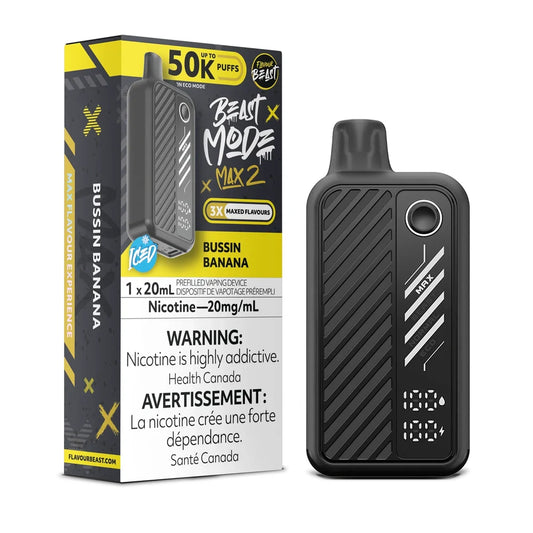 A Flavour Beast Mode Max 2 disposable vape in Bussin Banana flavor stands next to its black and yellow retail packaging, which displays the 50,000 puff count, 20mg/mL nicotine strength, and health warning text.
