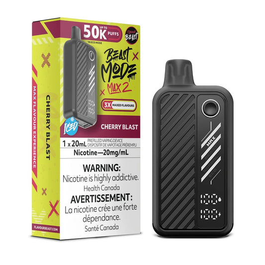 A black Flavour Beast Mode Max 2 disposable vape device stands next to its yellow and maroon packaging, which features the text Cherry Blast, 50K Puffs, and a 20mg/mL nicotine warning label.