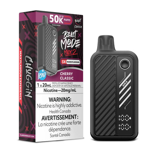 A Flavour Beast Mode Max 2 disposable vape in black sits next to its matching product box, which features a cherry red and black design with text including 50K Puffs, Cherry Classic, and a nicotine warning label.