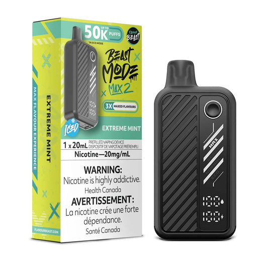 A black Beast Mode Max 2 disposable vape device stands next to its lime green and black product box, which features the text Beast Mode Max 2, Extreme Mint, 50K Puffs, and a nicotine warning label.