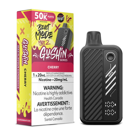 A black Beast Mode Max 2 Gushin Cherry disposable vape device stands next to its yellow and red packaging box, which features the Flavour Beast logo, a 50k puff count, and a 20mg/mL nicotine warning label.