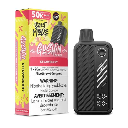 A Beast Mode Max 2 Gushin Strawberry disposable vape device stands next to its yellow and pink retail packaging, which features the Flavour Beast logo, a 50k puff count, and a 20mg/mL nicotine warning label, all set against a plain black background.