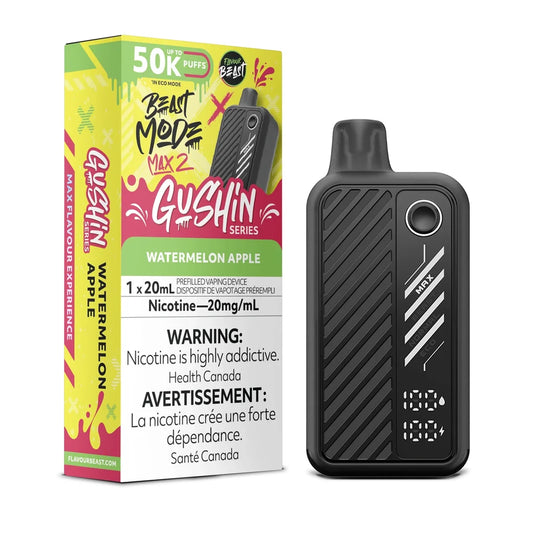 A black Beast Mode Max 2 disposable vape device stands next to its yellow and pink packaging box, which features the Gushin Series branding and Watermelon Apple flavor text, all set against a plain background.