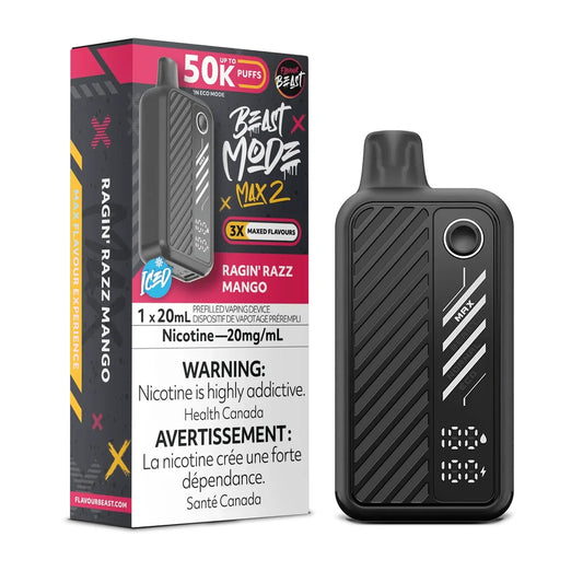 A black Flavour Beast Mode Max 2 disposable vape device stands next to its matching retail box, which features Ragin' Razz Mango branding, a 20mg/mL nicotine warning, and a 50K puff count indicator on a dark, minimalist background.