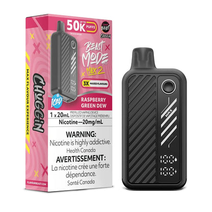 A black Beast Mode Max 2 disposable vape device stands next to its pink and white product box, which features the text Raspberry Green Dew, 50K Puffs, and a nicotine warning label against a plain background.