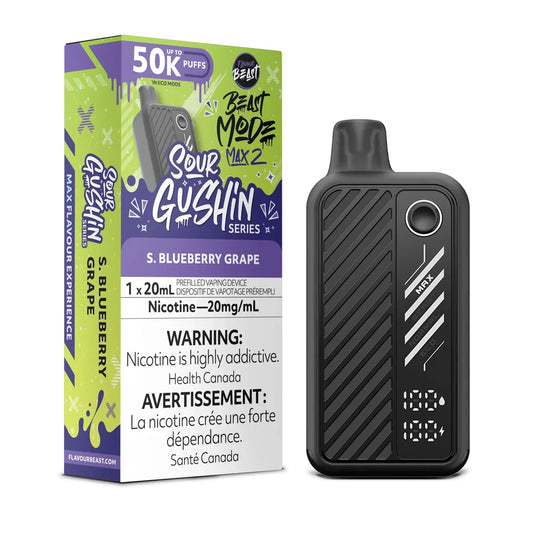 A Flavour Beast Mode Max 2 disposable vape device in black with a digital display sits next to its matching purple and green packaging box labeled S. Blueberry Grape and 20mg/mL nicotine.