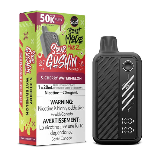A Flavour Beast Mode Max 2 disposable vape device in black stands next to its green and red packaging box, which features the text Sour Gushin Series, S. Cherry Watermelon, and 50K Puffs.
