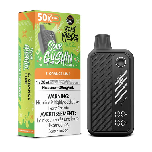 A Flavour Beast Mode Max 2 disposable vape device in black stands next to its green and orange packaging box, which features the text S. Orange Lime, 50K Puffs, and a nicotine warning label.