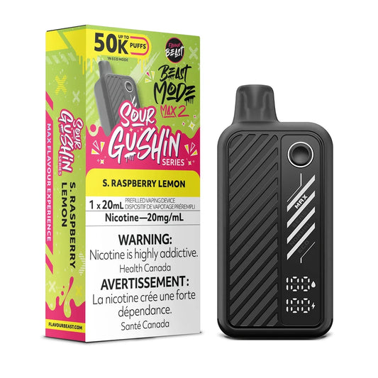 A black Flavour Beast Mode Max 2 disposable vape device stands next to its vibrant yellow and pink packaging, which features the Sour Gushin Series branding and S. Raspberry Lemon flavor label, all set against a plain black background.