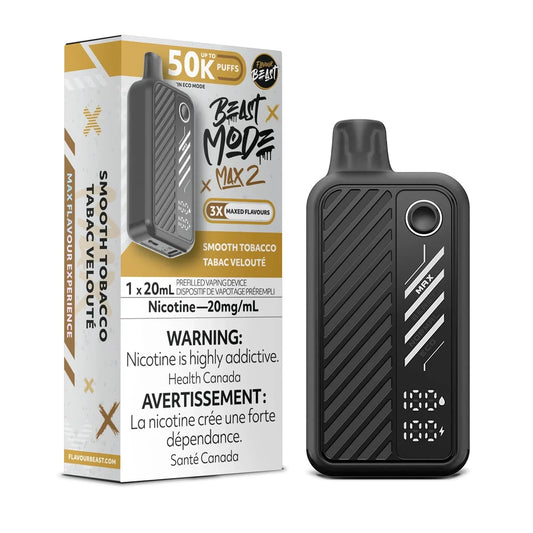 A Beast Mode Max 2 disposable vape device in black stands next to its matching product box, which features gold accents and displays the Smooth Tobacco flavor name, a 50k puff count, and a 20mg/mL nicotine warning.