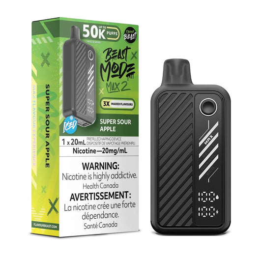 A black Flavour Beast Mode Max 2 disposable vape device stands next to its green and black packaging box, which features the text Super Sour Apple, 50K Puffs, and a nicotine warning label.