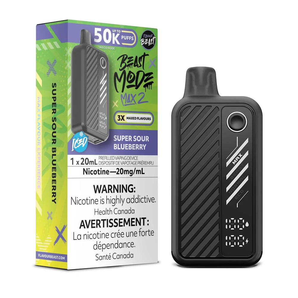 A black Beast Mode Max 2 disposable vape device stands next to its green and purple packaging, which features the text Super Sour Blueberry, 50K Puffs, and a 20mg/mL nicotine warning label.