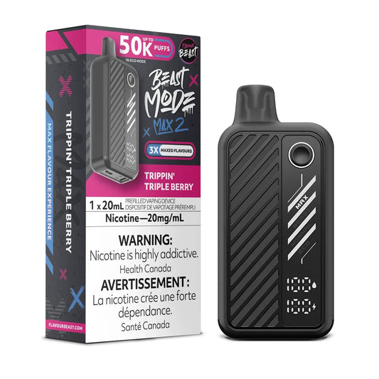 A black Beast Mode Max 2 disposable vape device stands next to its matching pink and black packaging box, which features the Trippin' Triple Berry flavor name, a 50k puff count, and a 20mg/mL nicotine warning label.