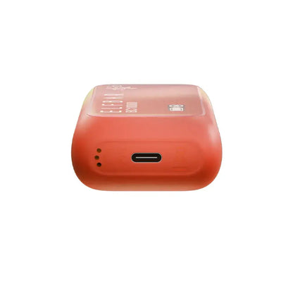 Bottom view of an orange ELFBAR BC10000 Peach Berry disposable vape showing the USB-C charging port and airflow holes on a white background.
