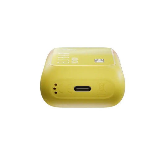Bottom view of a yellow ELFBAR BC10000 Peach Mango disposable vape showing the USB-C charging port and air intake holes on a white background.