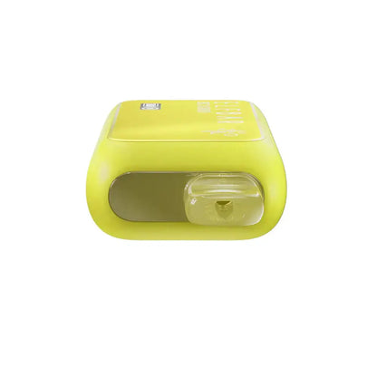 Top-down view of a yellow ELFBAR BC10000 Strawberry Banana disposable vape showing the clear plastic mouthpiece and a glossy top panel with faint branding.