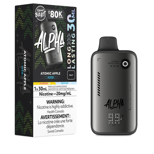 A Flavour Beast Alpha 80k Atomic Apple Iced disposable vape device stands next to its black and green packaging box, which features the product name, a 30mL capacity label, a 20mg/mL nicotine warning, and a fruit flavor indicator.