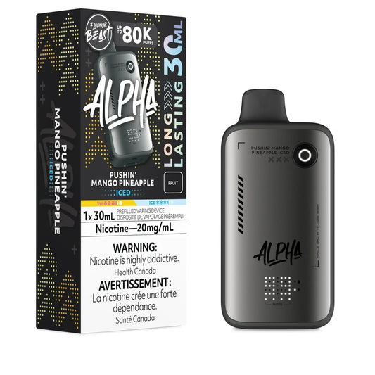 A Flavour Beast Alpha 80k disposable vape device in matte grey stands next to its matching black and yellow retail box, both labeled with the Pushin' Mango Pineapple Iced flavor, 20mg/mL nicotine strength, and 30mL capacity.