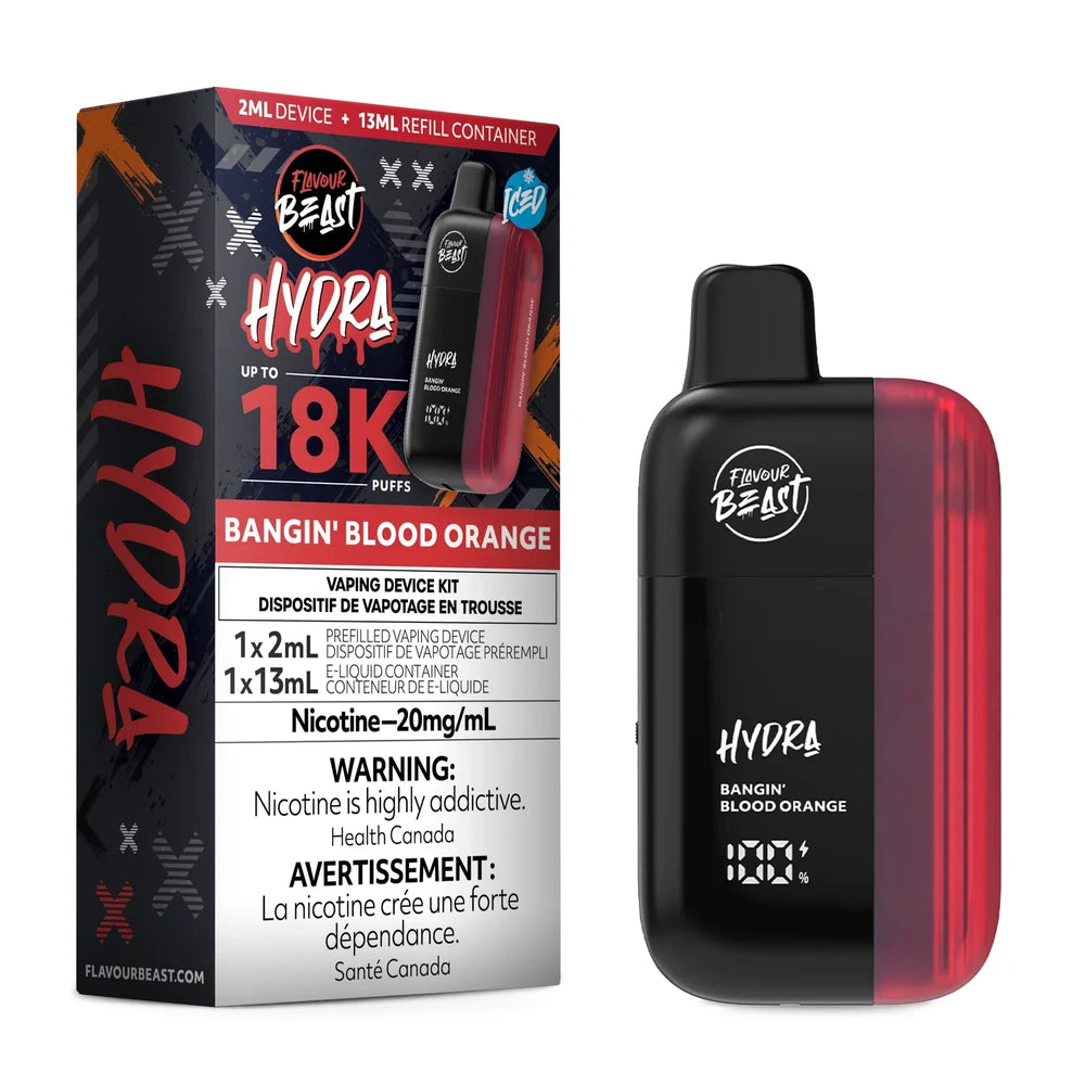 A Flavour Beast Hydra Bangin Blood Orange vaping device stands next to its black and red product packaging, which displays the 18K puff count, 20mg/mL nicotine strength, and includes a 2mL prefilled device and 13mL e-liquid container.