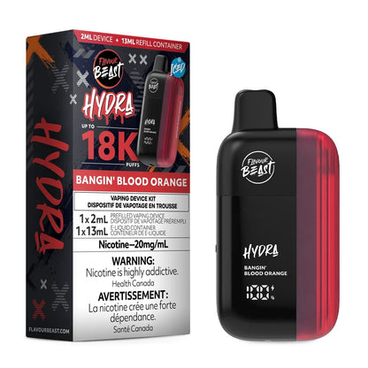A Flavour Beast Hydra Bangin Blood Orange vaping device stands next to its black and red product packaging, which displays the 18K puff count, 20mg/mL nicotine strength, and includes a 2mL prefilled device and 13mL e-liquid container.