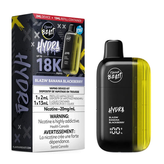 A Flavour Beast Hydra Blazin Banana Blackberry disposable vape kit featuring a black and yellow device with a digital display next to its matching product packaging box.