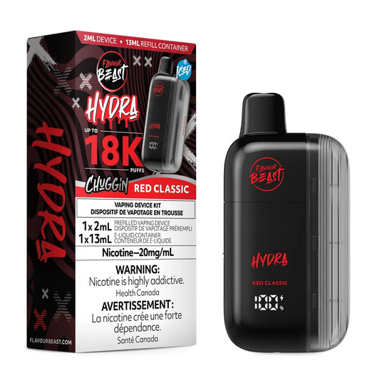 A Flavour Beast Hydra Chuggin' Red Classic disposable vape device stands next to its black and red packaging box, which displays the product name, a 18K puff count, and nicotine warning labels.