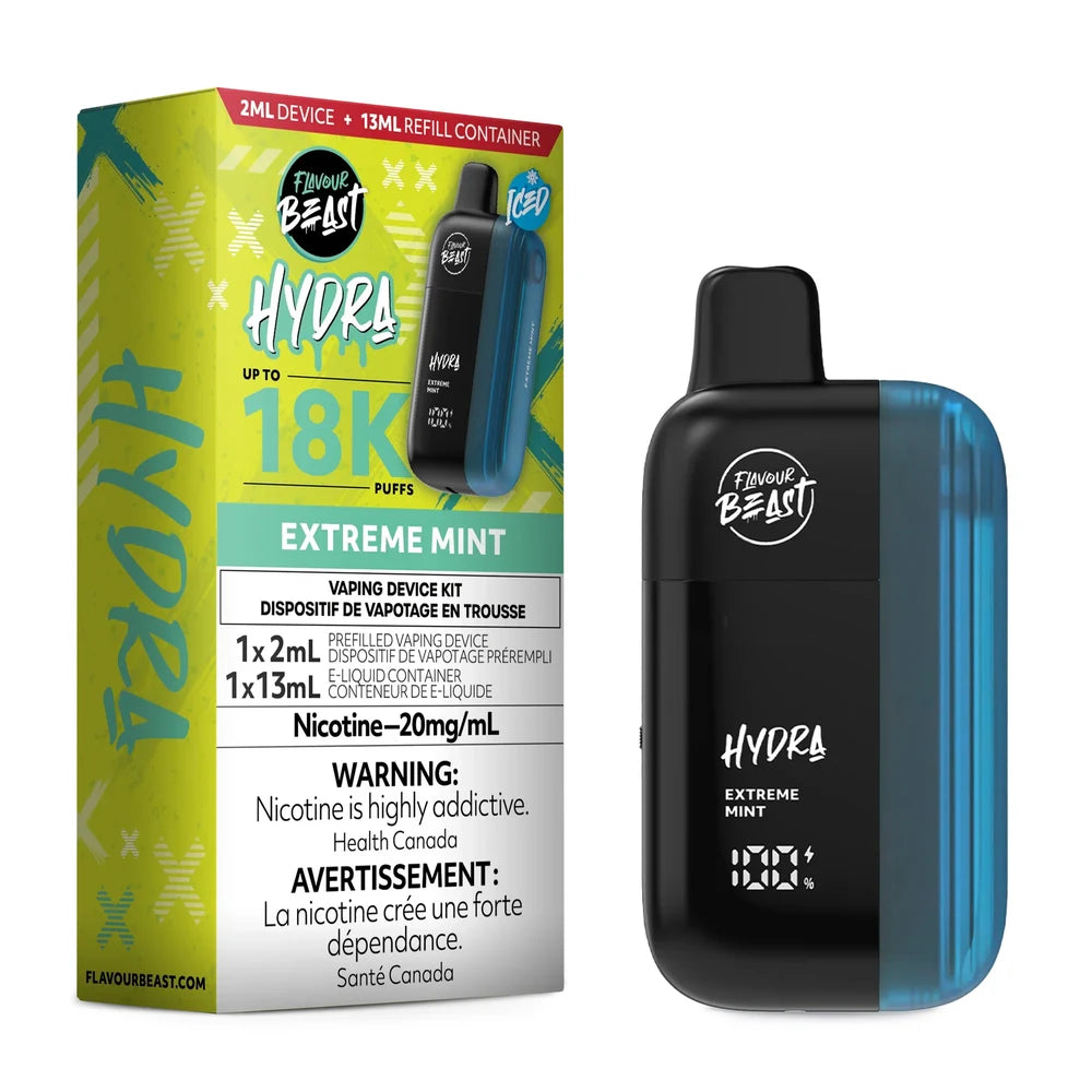 A Flavour Beast Hydra Extreme Mint disposable vape device stands next to its lime green and black product packaging, which displays the 18K puff count, 20mg/mL nicotine strength, and a 2ml device plus 13ml refill container configuration.