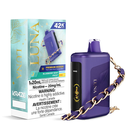 Kraze Luna Blueberry Mint Frost disposable vape featuring a purple leather-textured device with a gold chain strap next to its light blue and gold packaging.