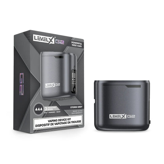 A Level X Boost G2 vaping device kit in storm grey is displayed next to its product packaging, which features a 1000 mAh battery capacity, three adjustable modes, and branding text.