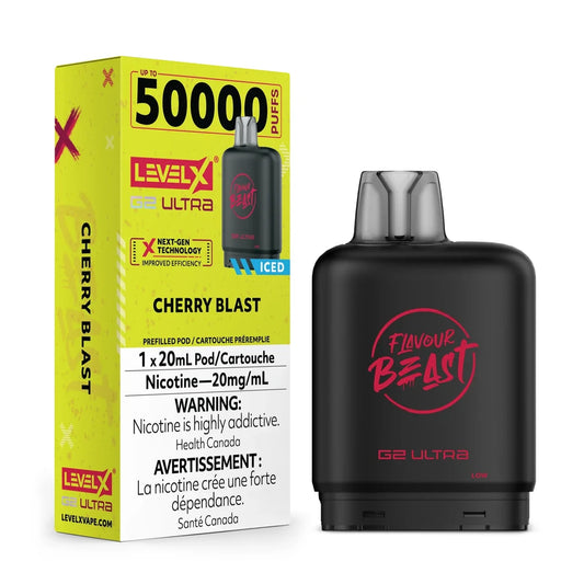 A Level X G2 Ultra Cherry Blast iced vape pod sits next to its yellow and black retail packaging, which displays the Flavour Beast logo, a 50,000 puff count, and Health Canada nicotine warning labels.